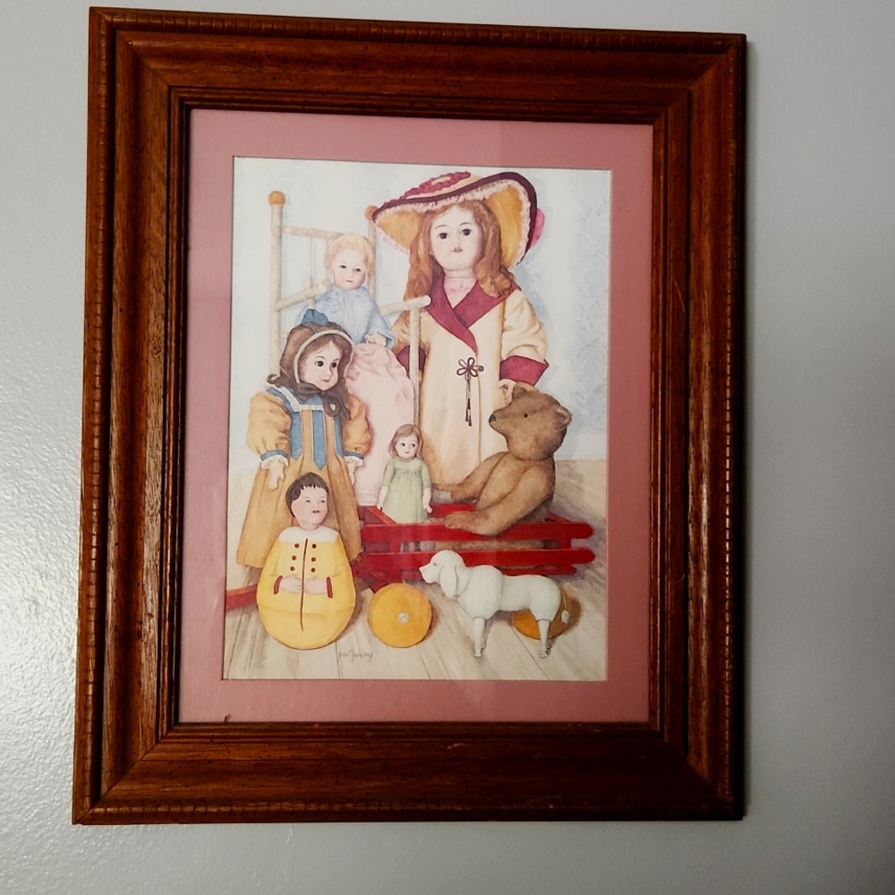 House of Lloyd doll picture with wood frame.  Dolls, wagon, bear and dog